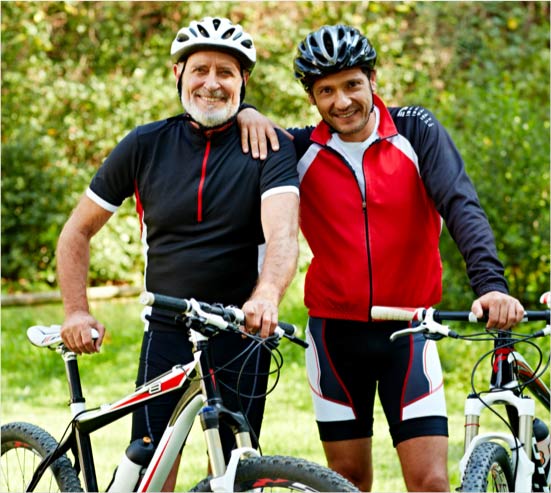 senior man on a bike ride with his son